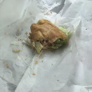 What's left of the grilled shrimp po-boy.