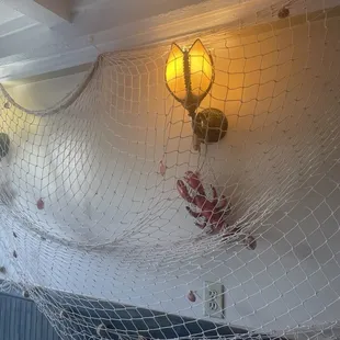 a fish net with a light on it