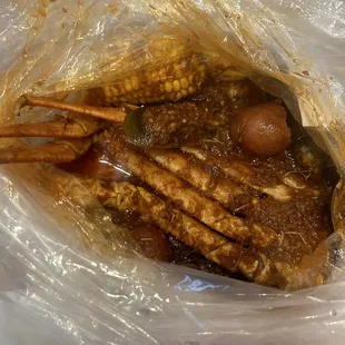 Snow crabs, green mussels, corn, egg, potato extra sauce