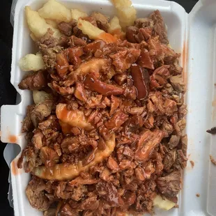ows pulled pork and fries in a styrofoam container