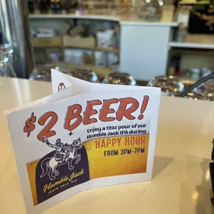 a sign for $ 2 beer