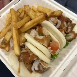 Bao buns with crispy pork served with fries