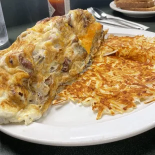 Meat lover omelette with hasbrowns.