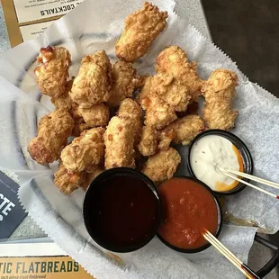 Hand-Breaded Cheese Curds asked for side of hot house sauce (far left)