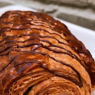 a croissant pastry on a plate
