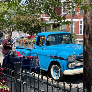 Cute flower truck set up outside coffeeshop