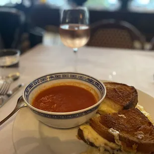 Grilled cheese sandwich and tomato soup and a chilled glass of rosé wine.