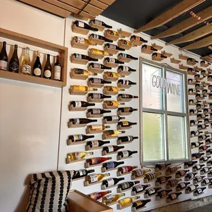 a wall of wine bottles in a wine cellar