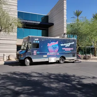 a food truck parked in front of a building