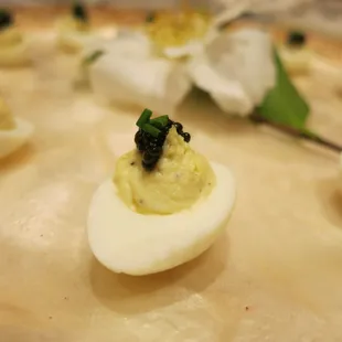 Deviled quail egg, creme fraiche, caviar