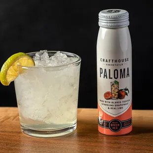 a glass of paloma and a bottle of paloma