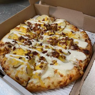 a pizza in a pizza box