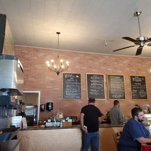 a brick wall with menus on it