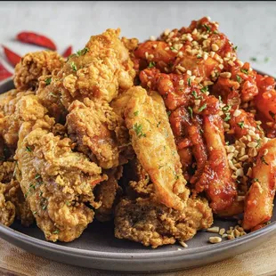 a plate of fried chicken with chili sauce