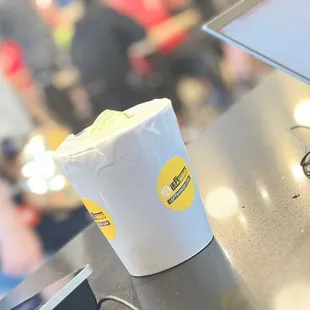 a cup of coffee and a cell phone