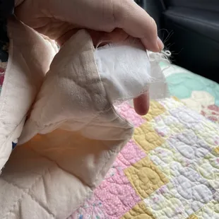 Tag from China on "hand stitched quilt"