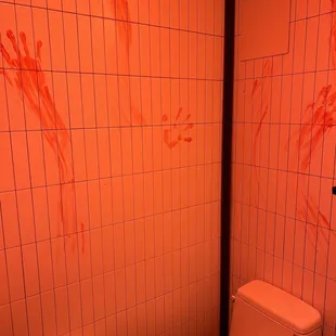 Bloody hand prints in bathroom