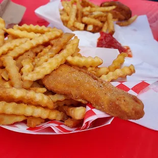 The chicken strips with fries.