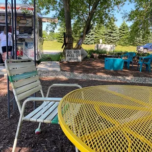 a yellow table and chairs