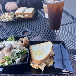 Crab meat grilled cheese, Caesar salad, tuna salad sandwich, cold brew, hot coffee