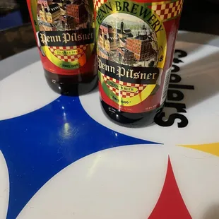 two bottles of beer on a table