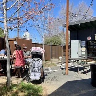 people sitting at a table outside