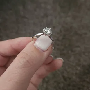 This was a solitaire ring until I added my mom&apos;s diamonds around it.