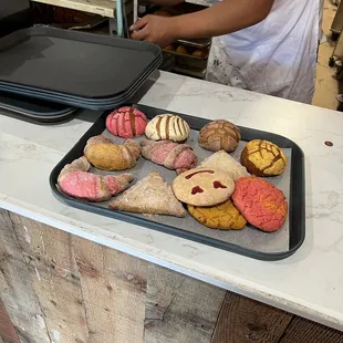 a baker preparing a variety of pastries