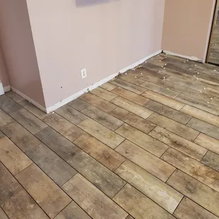 a wood floor in an empty room