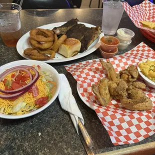 Our food ribs, salad, fish with seasoned fried,chucked and onion rings.