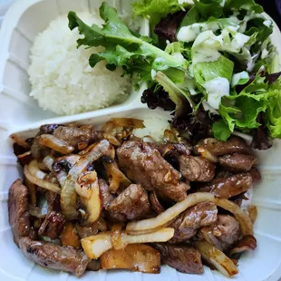 Ribeye steak with mushrooms and onions