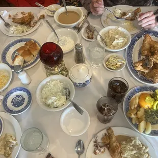 Fried chicken, cottage cheese, cole slaw, mashed potatoes, gravy, creamed corn.