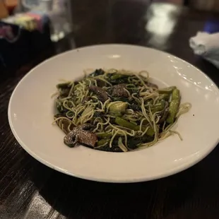 Custom pasta dish with mushrooms, spinach and asparagus.