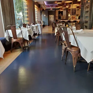 a restaurant with tables and chairs