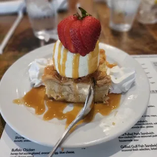 a plate of dessert with a strawberry on top