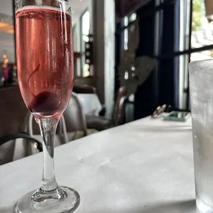 a glass of wine and a glass of ice
