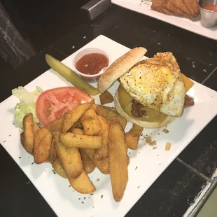 a plate of food with a sandwich and french fries
