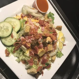 a plate of salad with dressing