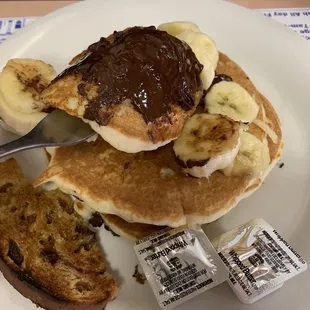 Full stack (3) pancakes with chocolate chips as topping (they melted). Comes with butter and syrup.