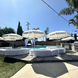 Pool party  umbrellas with white lounge's