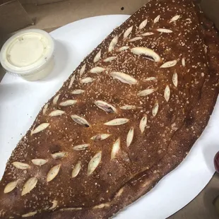 Pretzel Stromboli - soft pretzel crust stuffed w/Ham, Mozz and a tiny bit of yellow mustard.