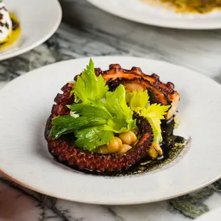 a plate of food on a marble table