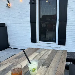 a drink on a picnic table