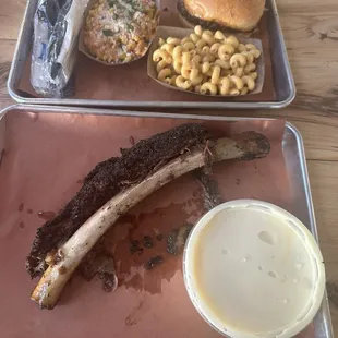 Beef brisket sandwich, smoked Mac and cheese, Tex mex corn, beef ribs, and banana pudding