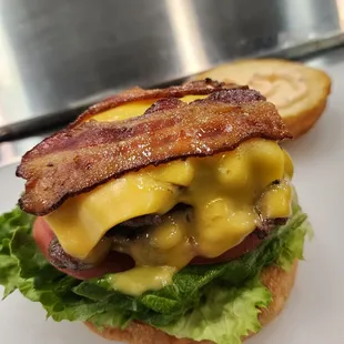 bacon, cheese, and lettuce on a bun