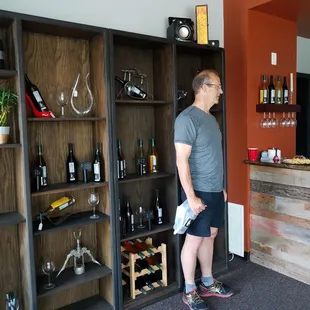 a man standing in a wine cellar