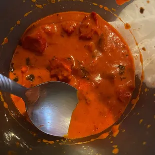 a bowl of soup with a spoon in it