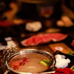 a hot pot of soup on a table