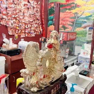 Wall of pho challenge and cash register inside