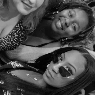 a black and white photo of three women